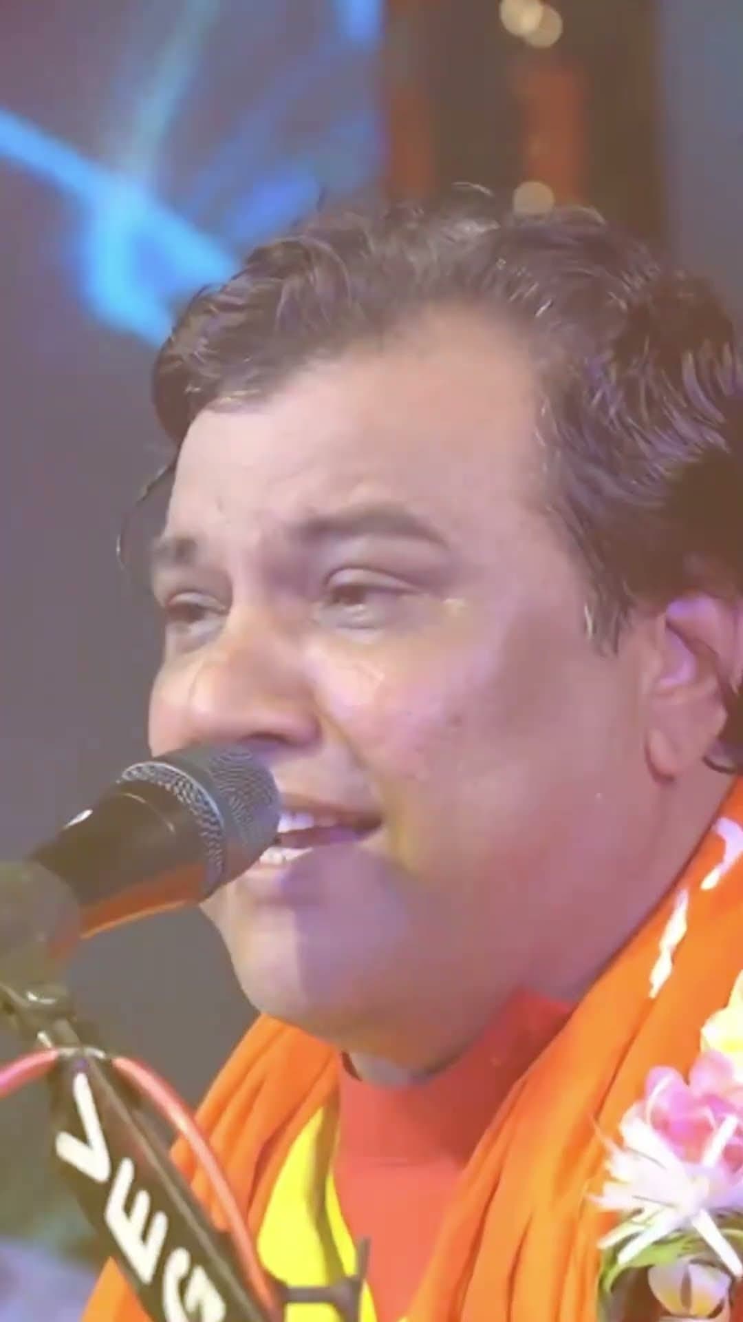 Kirtidan Gadhvi singing with joy at a Janmashtami celebration